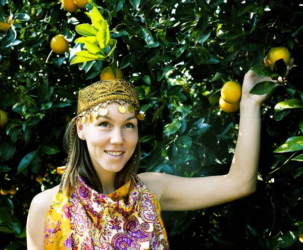 pretty islam woman in orange grove smiling, real muslim girl