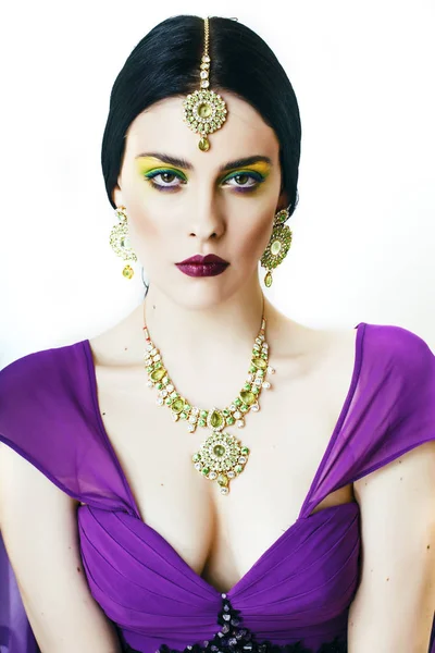 young pretty caucasian woman like indian in ethnic jewelry closeup