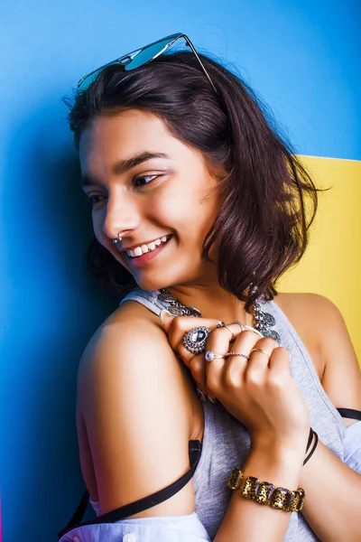 lifestyle people concept. young pretty smiling indian girl with long nails wearing lot of jewelry rings, asian summer happy cool close up copyspace