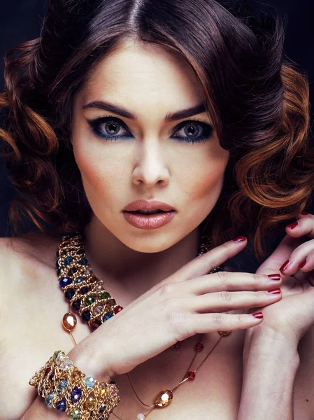 beauty rich woman with bright makeup wearing luxury jewellery looks like mature close up, fashion lady curly hairstyle