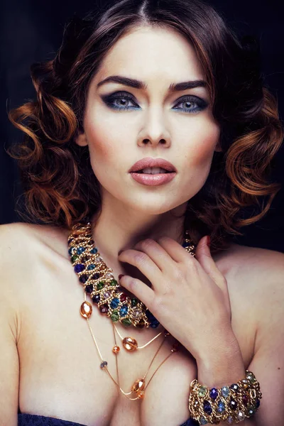 beauty rich woman with bright makeup wearing luxury jewellery looks like mature close up, fashion lady curly hairstyle