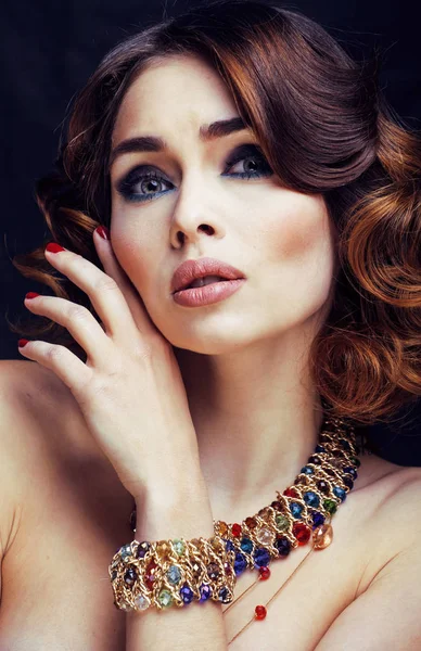 beauty rich woman with bright makeup wearing luxury jewellery looks like mature close up, fashion lady curly hairstyle