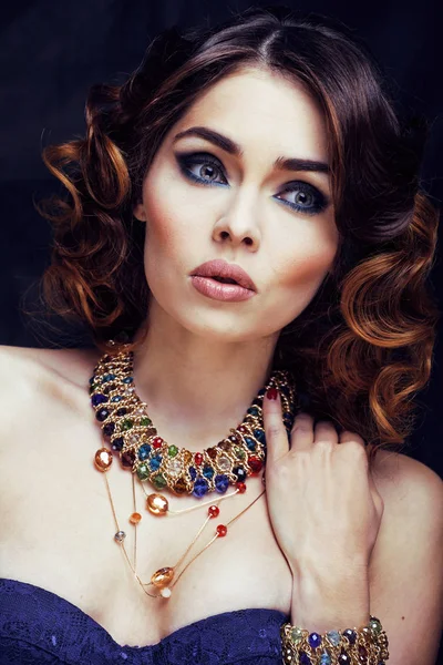 beauty rich woman with bright makeup wearing luxury jewellery looks like mature close up, fashion lady curly hairstyle