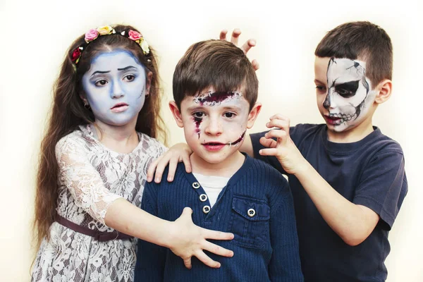 zombie apocalypse kids concept. Birthday party celebration facepaint on children dead bride, scar face, skeleton together having fun, halloween people