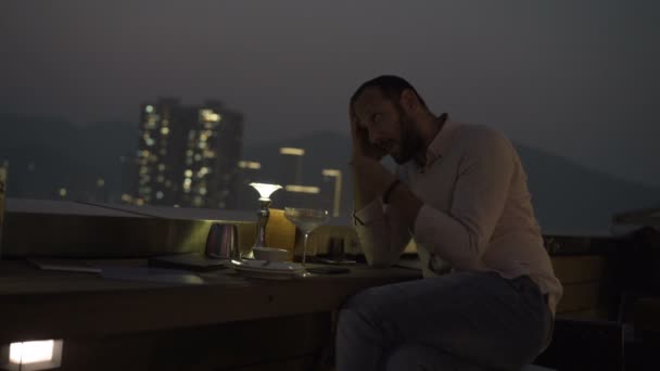 Sad Unhappy Man Drinking Cocktail Sitting Terrace Bar Night — Stock Video