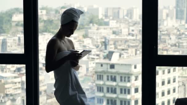 Young Woman Towel Texting Smartphone Window Home Stock Video