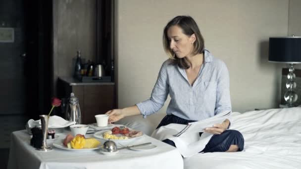 Young Pretty Businesswoman Reading Magazine Drinking Tea Breakfast Hotel — Stock Video