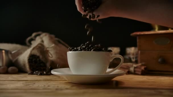 Female hand pouring extra coffee for strong espresso in fulfilled coffee cup — Stock Video