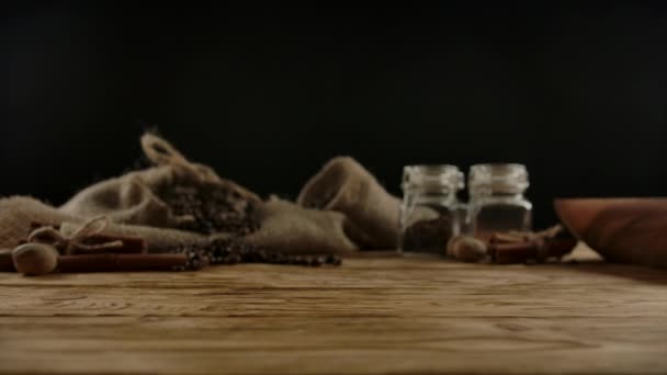 Unfaceable waiter serving white modern ceramic cup of hot beverage on wood desk — Stock Video