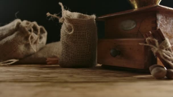 Drop of burlap bag fulfilled with arabica coffee grains. Roasted beans spreading — Stock Video