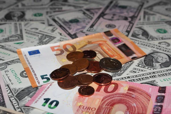 us dollars and euros money in banknotes and coins. Photo for the background