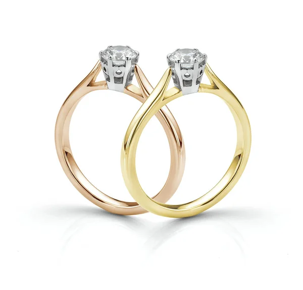 Çift Solitaire Diamond Rings gölge beyaz arka plan üzerinde Izole. Gül altın ve sarı altın geleneksel nişan yüzükleri. 