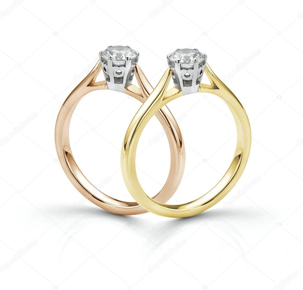 Pair of Solitaire Diamond Rings Isolated on White Background With Shadow. Rose Gold and Yellow Gold Traditional Engagement Rings. 
