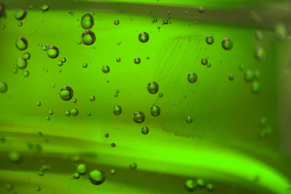 Bubbles in a green oil liquid — Stock Photo, Image