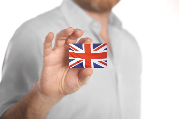 Empresario con tarjeta de visita con bandera del Reino Unido — Foto de Stock