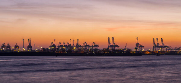 Panorama of container port in Hamburg, Germany at night