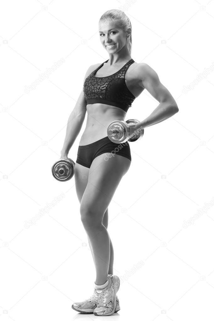 fitness woman in sportswear doing exercises with dumbells.