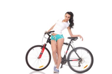 bir bisiklet üzerinde genç atletik ve ince kız