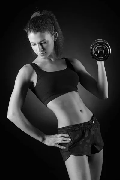 Fitness woman in doing exercises with dumbells. — Stock Photo, Image