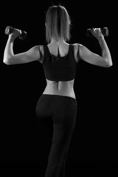 Fitness woman in doing exercises with dumbells. — Stock Photo, Image