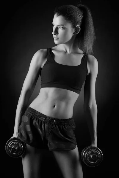 Fitness woman in doing exercises with dumbells. — Stock Photo, Image