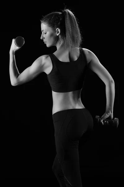 Mujer fitness en hacer ejercicios con pesas . —  Fotos de Stock