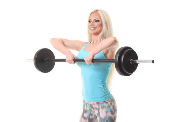 Sorrindo mulher desportiva exercitando com barbell — Fotografia de Stock