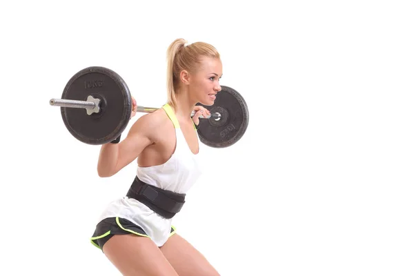 Mooie fit vrouw glimlachend met een barbell — Stockfoto