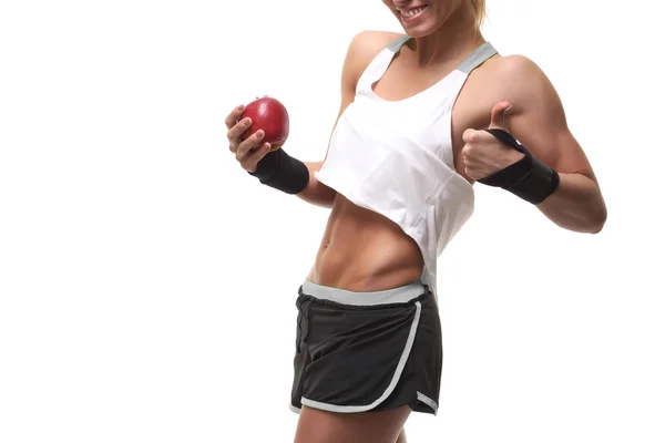 Schlanke, muskulöse Frau mit rotem Apfel — Stockfoto