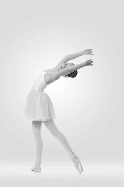 Young girl ballerina posing on white background — Stock Photo, Image