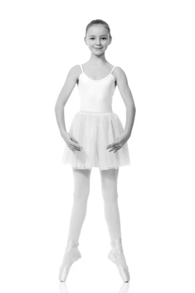 Young girl ballerina posing on white background — Stock Photo, Image