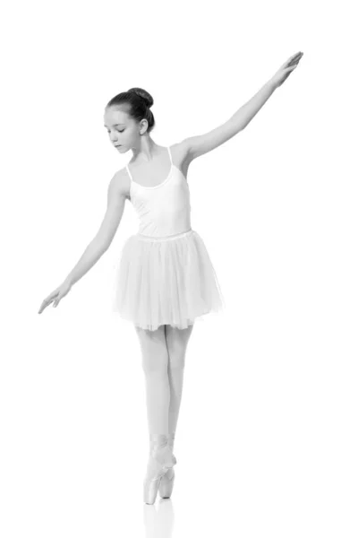 Young girl ballerina posing on white background — Stock Photo, Image