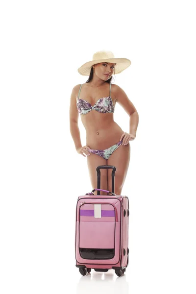 Young woman with suitcase going on a holiday — Stock Photo, Image