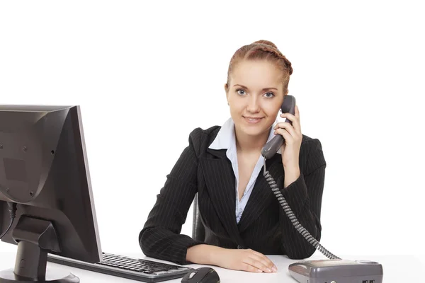 Young girl sitting at a table in the office — Stock Photo, Image