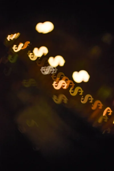 Gele Bokeh Vormen Van Een Geld Teken — Stockfoto