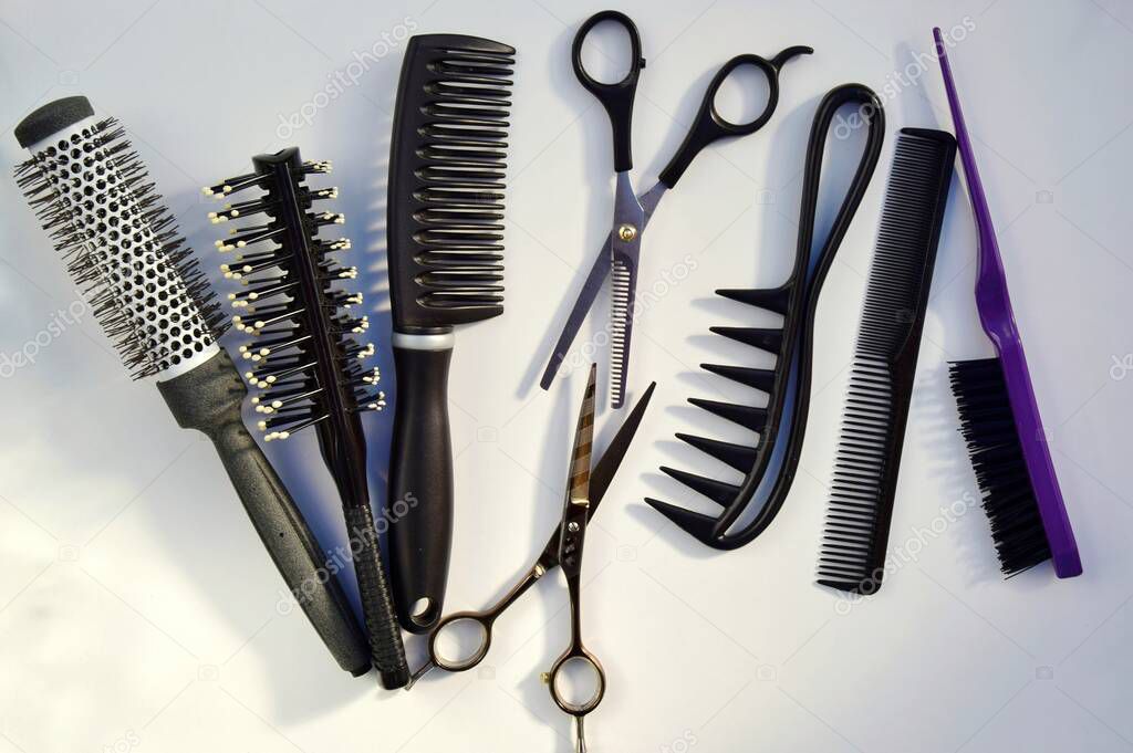 Hairdressing various accessories on a light background. concept of the hairdressing beauty industry