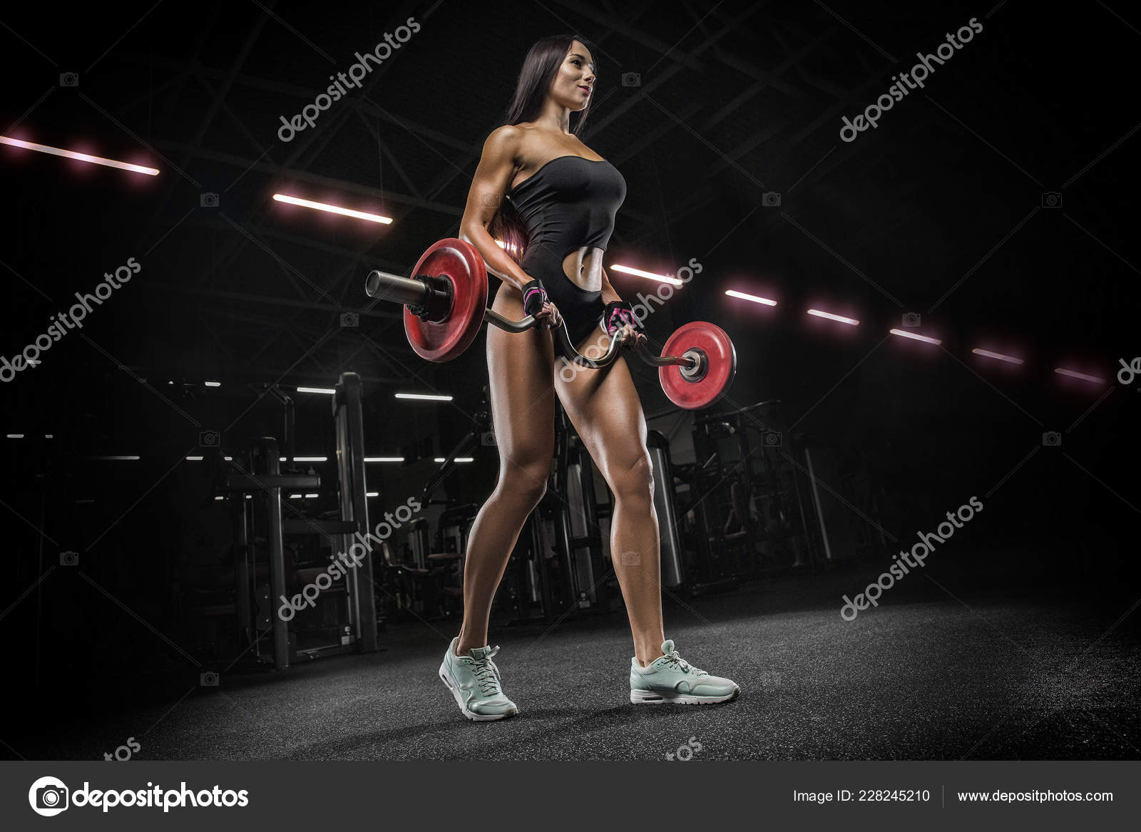 Fitness girl exercising with barbell in gym Stock Photo by  ©roman.l.olegovic 228245210