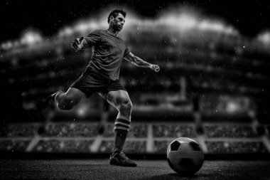 futbolcu alan stadyum üzerinde topu ile