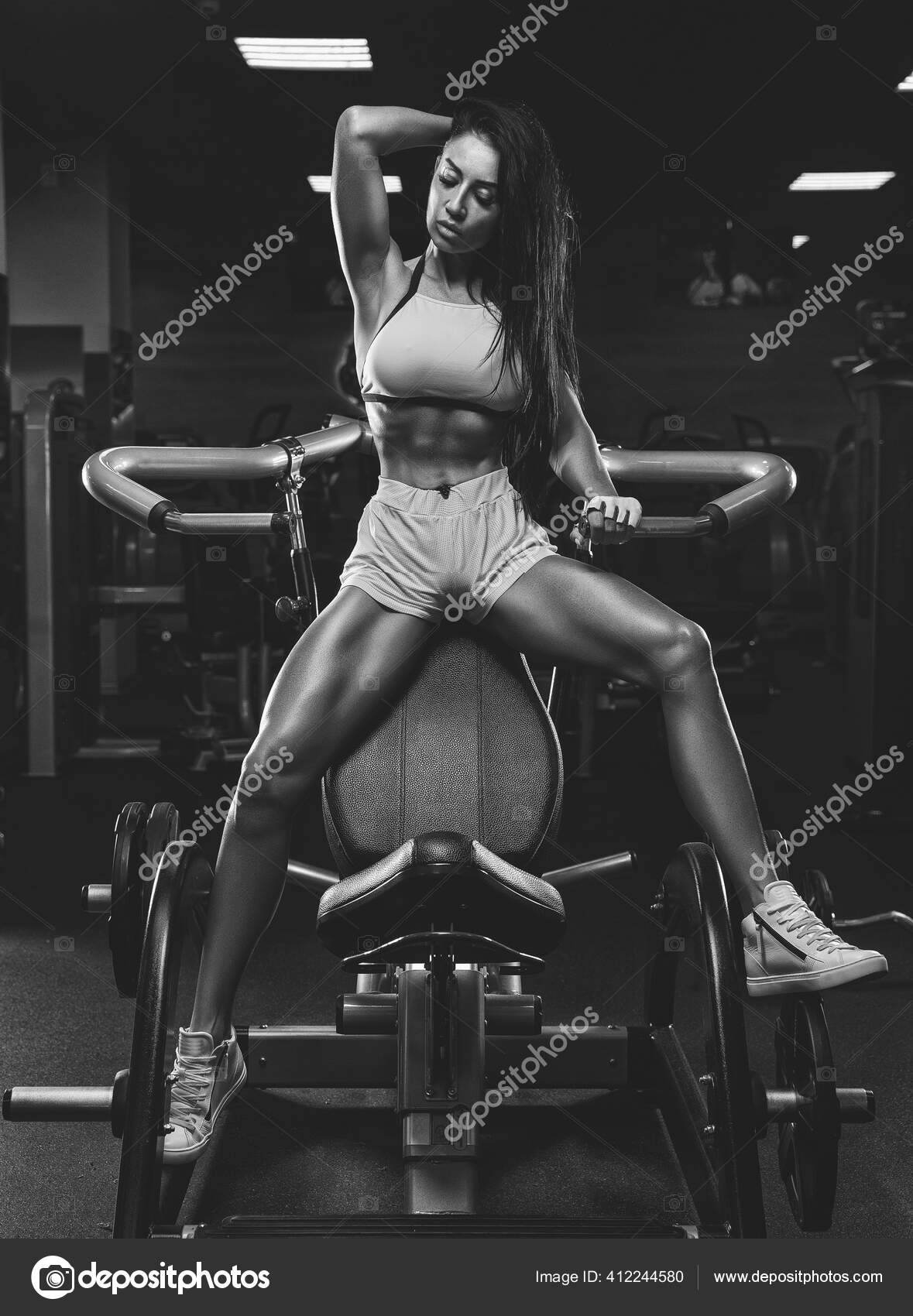 Girl shows her muscles strength Black and White Stock Photos & Images -  Alamy