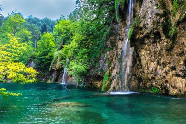 The Plitvice Lakes National Park, Croatias most popular tourist attraction. clipart