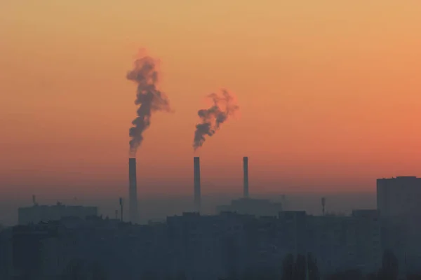 Factory smoke at sunset sky — Stock Photo, Image