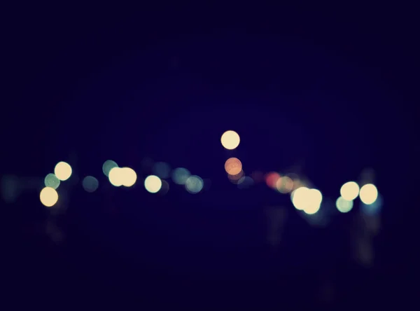Abstract urban night light bokeh, defocused background — Stock Photo, Image