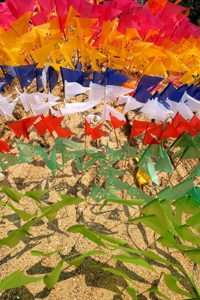 Flag on a heap of sand in Songkran festival at Thailand — Stock Photo, Image