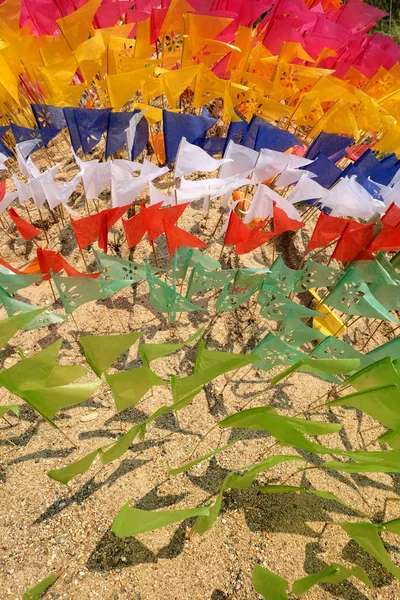 Flag on a heap of sand in Songkran festival at Thailand — Stock Photo, Image