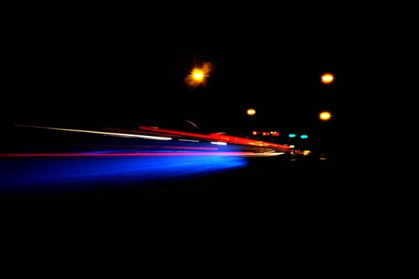 Blurry Illumination and night lights, car traffic motion blur — Stock Photo, Image