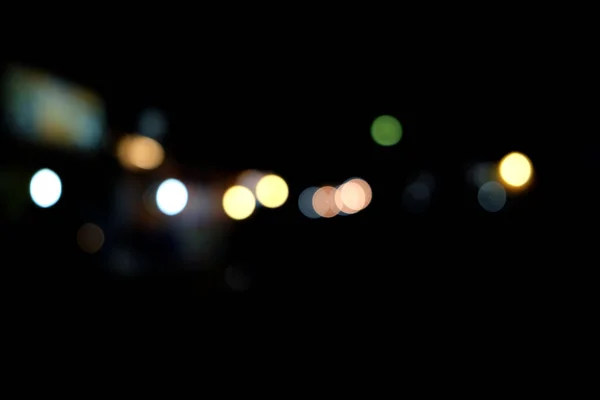 Abstrakte städtische Nachtlicht Bokeh, defokussierter Hintergrund — Stockfoto