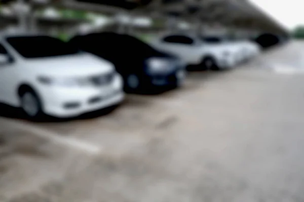 Abstrato carros embaçados estacionamento com luz bokeh Fundo — Fotografia de Stock