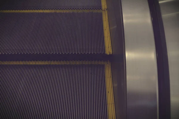 Abstract escalator in shopping mall, Moving up staircase, yellow — Stock Photo, Image