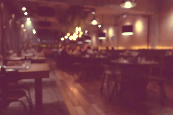 Coffee shop blur background with bokeh light with vintage filter — Stock Photo, Image