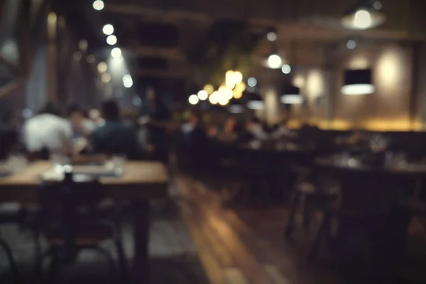 Coffee shop blur background with bokeh light with vintage filter — Stock Photo, Image